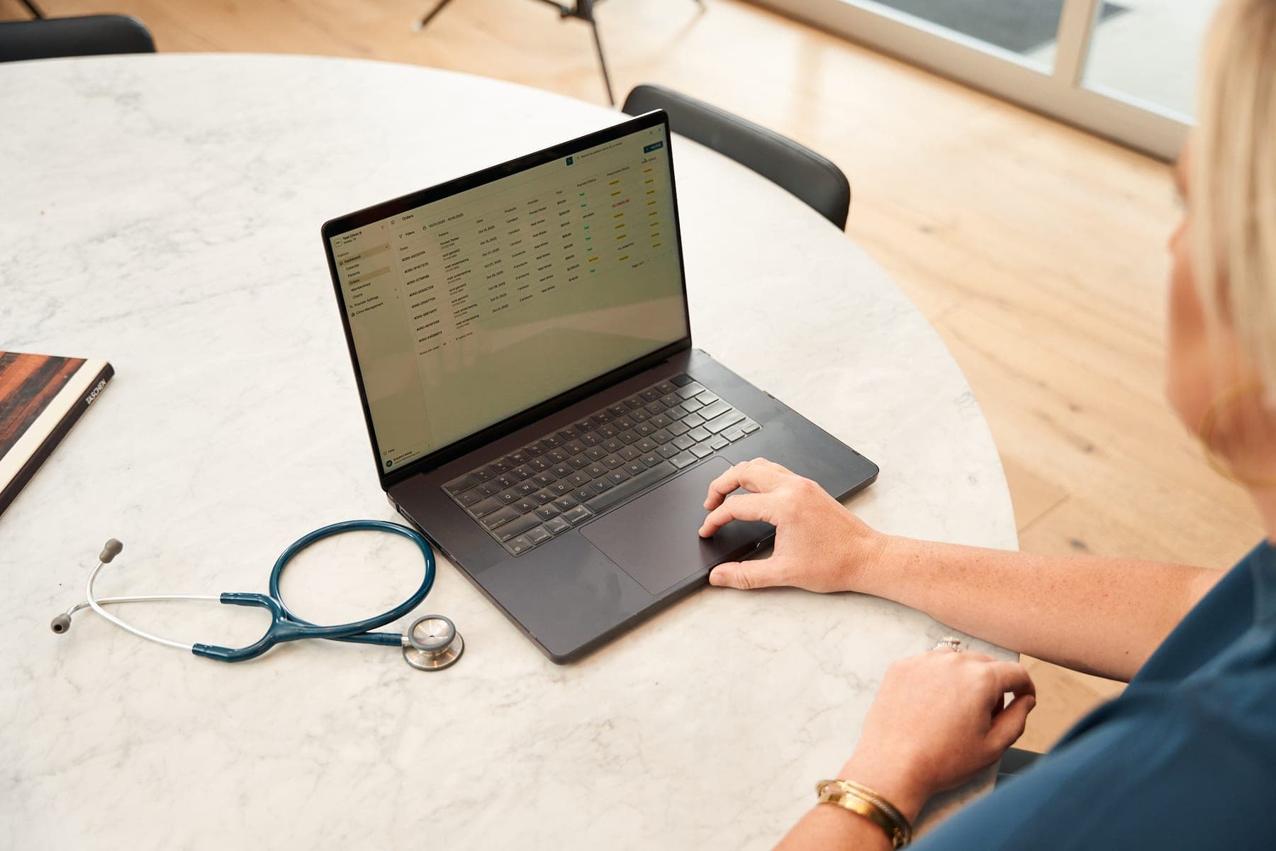 Clinic workspace with orders open on a laptop
